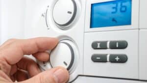 hand operating a boiler