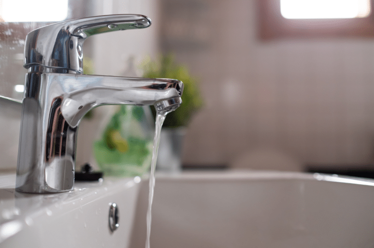 a picture of a tap with low water pressure flow trickle